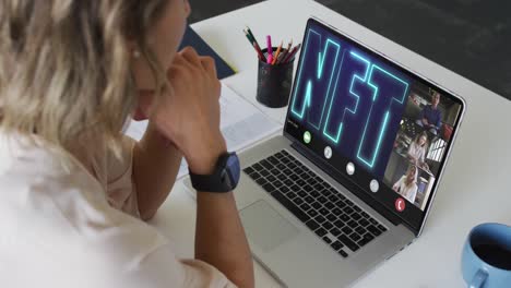 Caucasian businesswoman using laptop for video call with diverse business colleagues
