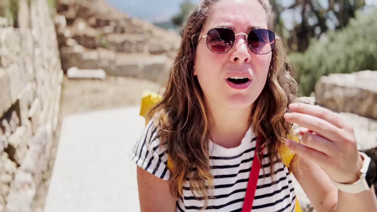 Young Tourist Vlogging on a Path at a Historic Site, Athens, Greece
