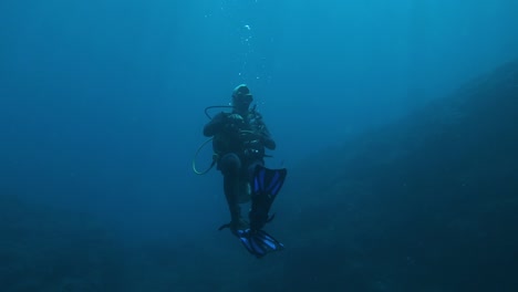 lonely diver in the blue sea