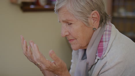 portrait-of-senior-caucasian-woman-praying-looking-up-hopeful-retired-elderly-female-in-retirement-home