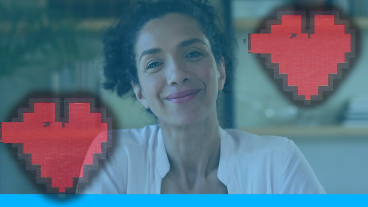 animación de iconos de corazón sobre una sonrisa de una doctora biracial