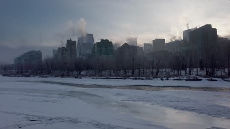 frozen river skyscrapers steaming downtown calgary