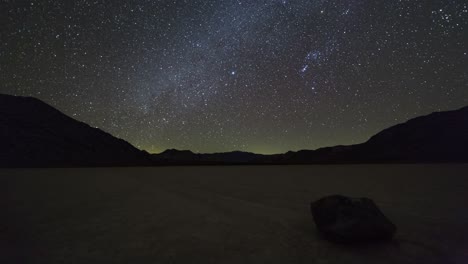Motion-time-lapse-of-the-milky-way-and-night-sky-over-a-moving-rock-on-the-Racetrack-Playa