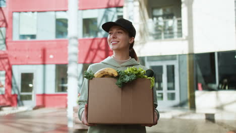 Courier-holding-box-outdoors