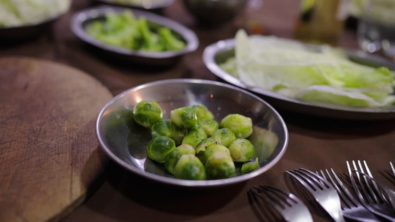 Tender cooked Brussels sprouts served with fresh ingredients for traditional Bagna Cauda.