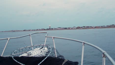 Fishing-boat-with-net-and-rails-rocks-side-to-side,-establishing-dutch