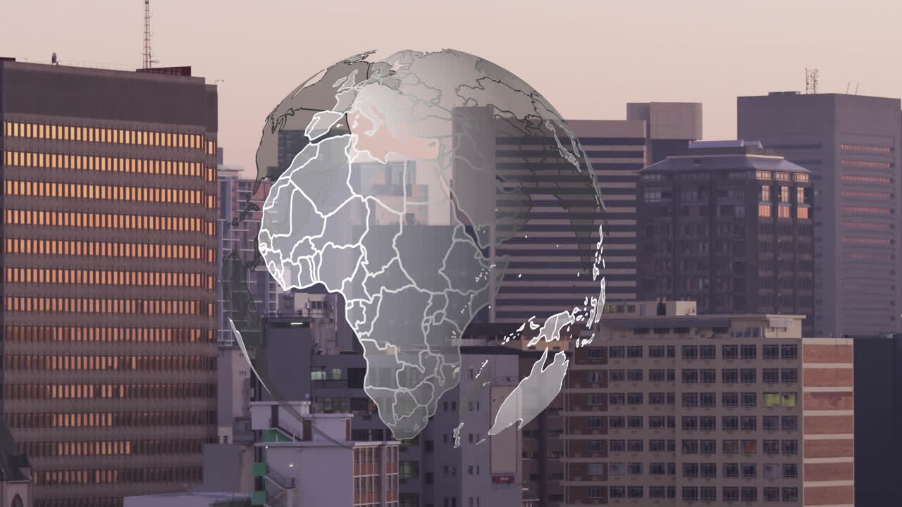 Rotating globe animation over cityscape with tall buildings