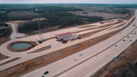 commercial trucks driving next to a closed weigh station