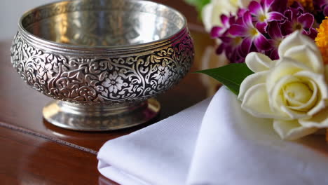 silver bowl with floral offering