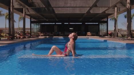 beautiful girl laying on the pool