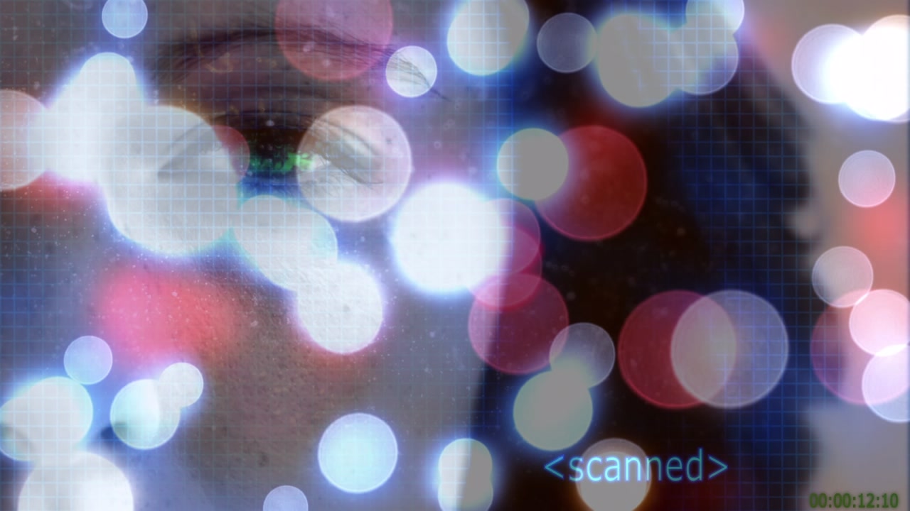 Animation of snow falling over blurred christmas lights