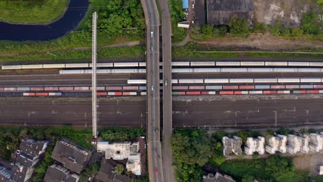 bird's eye view of railroad train track and many cargo container in vasai, mumbai, india - drone shot