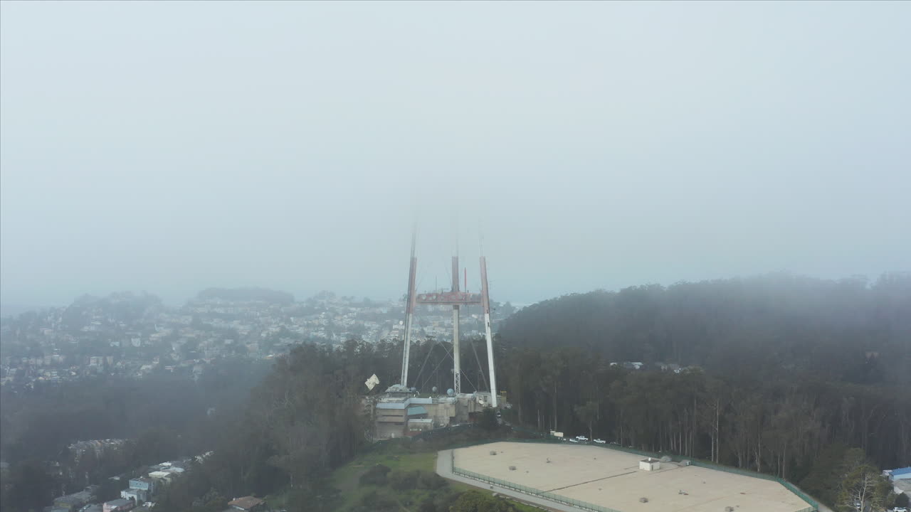 Aerial drone shot through the fog over Twin Peaks, California, San Francisco, USA