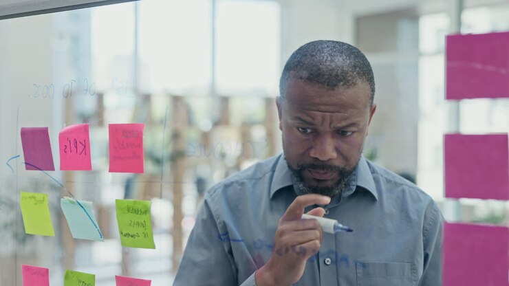 Business, black man and thinking of planning