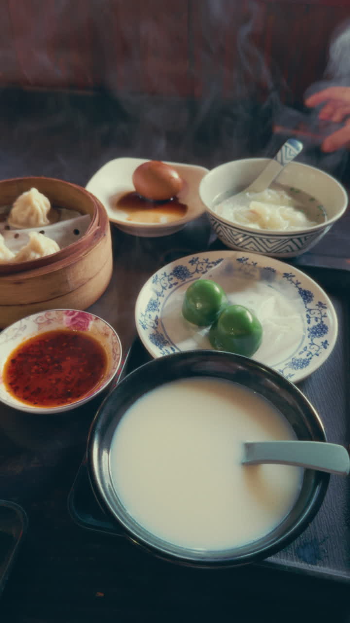 A traditional Chinese breakfast in Wuzhen, featuring dumplings, tea eggs, and rice porridge
