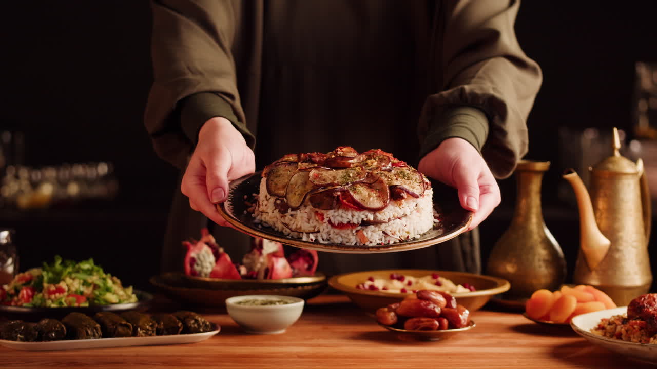 Woman Serving a Delicious Middle Eastern Rice Dish