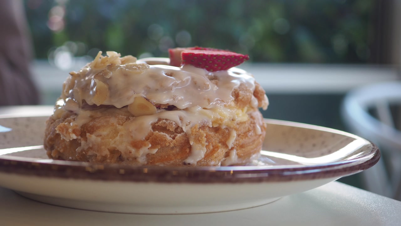 Appetizing Pastry Dessert with White Icing and Fresh Strawberry