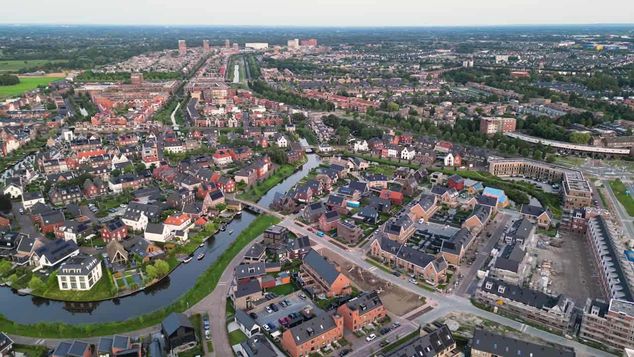 Residential area Vathorst in Amersfoort seen from above at sunset with golden glow over modern housing