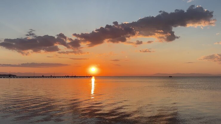 Sunset over Mediterranean sea Greece calm beautiful big orange sun setting