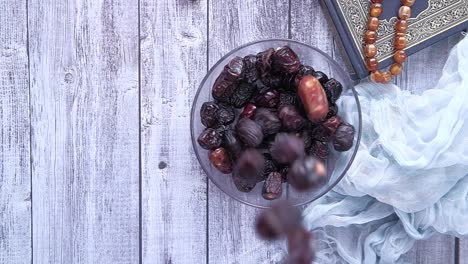 dates, quran, and prayer beads