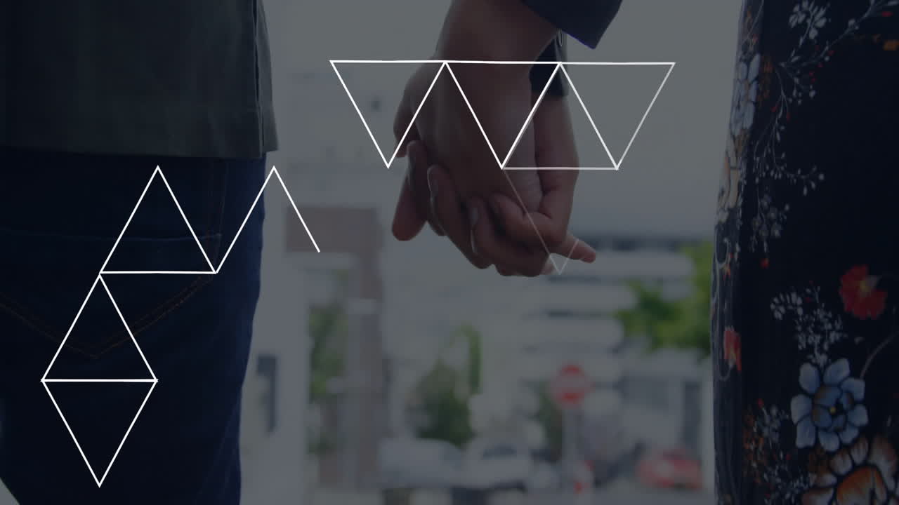 Holding hands, two people with geometric triangle animation overlay, abstract design