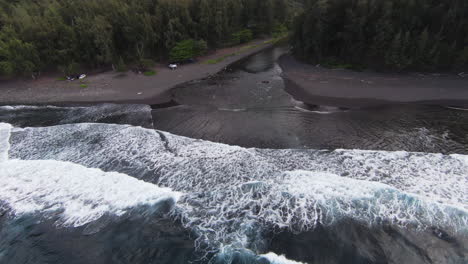 Fpv-Flight-from-the-wide-ocean-into-jungle-river-of-Hawaii-with-mountains-in-background