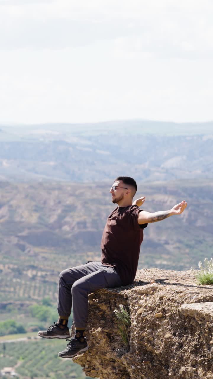 Hiker walking on trail with scenic view in gorafe, spain. Vertical