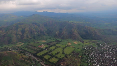 overcast flight leaves sake, congo over rolling rift valley mountains