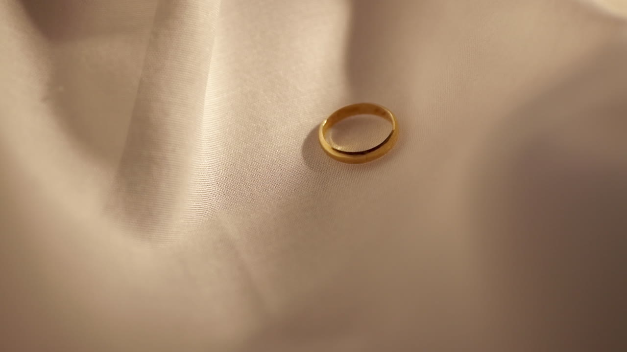 Gold Rings on velvet fabric background. Jewelry for Wedding or engagement.