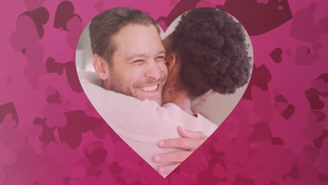 animation of hearts over diverse couple embracing