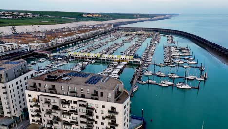 breathtaking drone flyover of brighton marina showcasing yachts, boats, and waterfront living. ideal for uk coastal, travel, lifestyle, and stock video content.