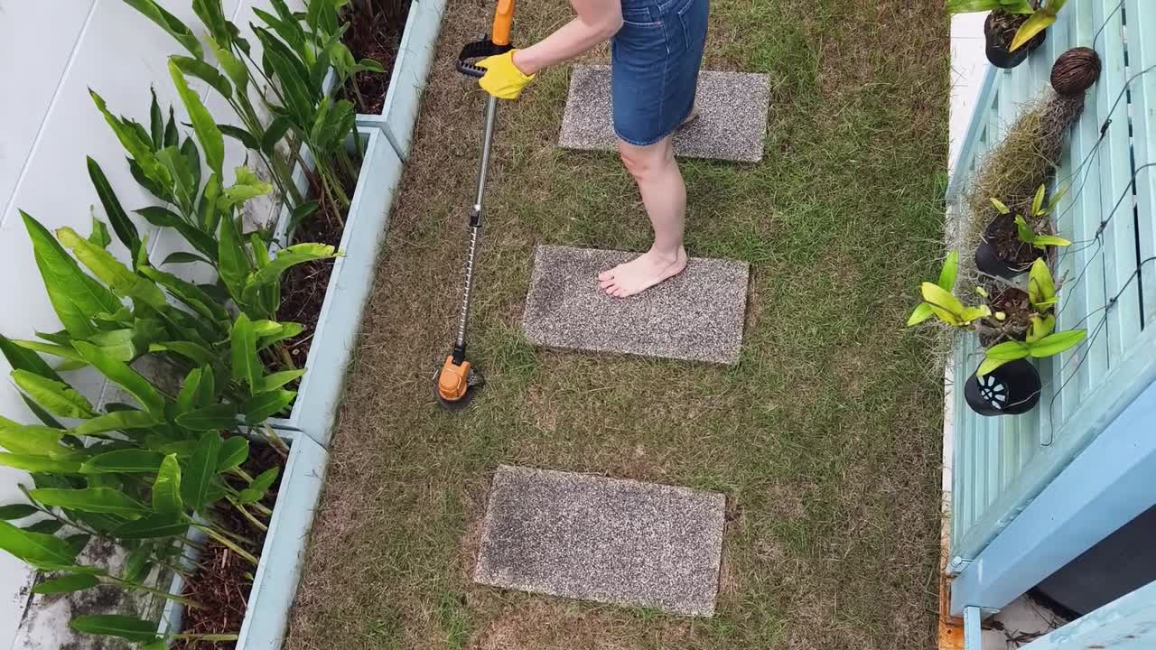 Woman doing yard work barefoot