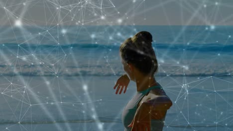 animación de redes de conexiones sobre mujer caucásica practicando yoga en la playa