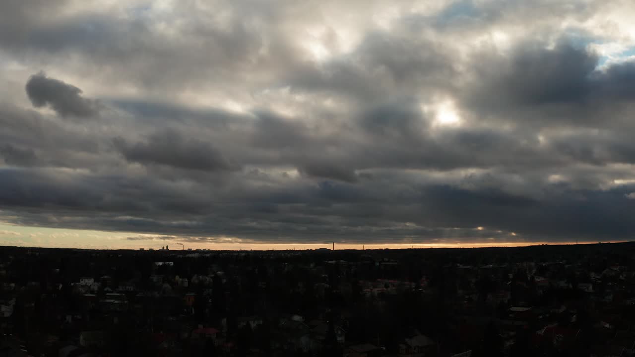 Drone shot of dramatic, and very cloudy sky over the city