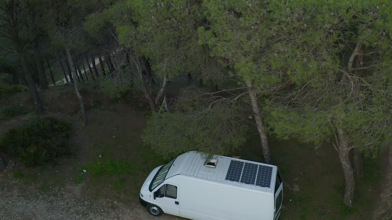 Camper van parked near trees