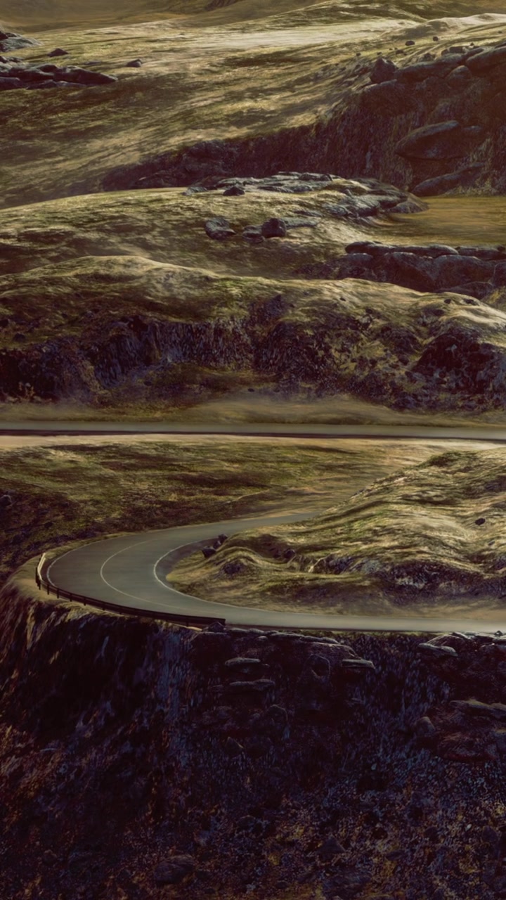 Scenic road bends through rugged landscape in a remote area