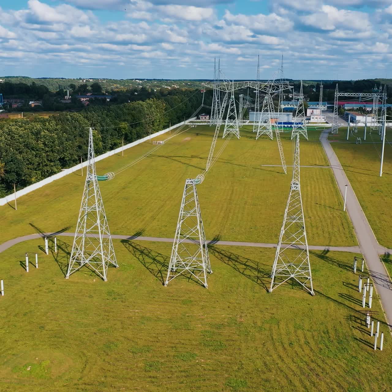 Big electric distribution industry. High voltage construction lines aerial view