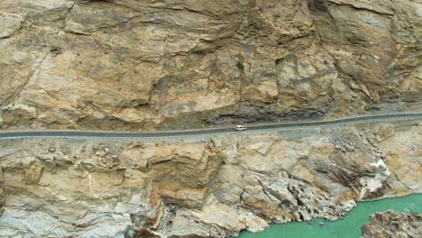 Static-aerial-view-of-JSR-Road-with-vehicles-driving-on-it-in-Skardu,-Pakistan