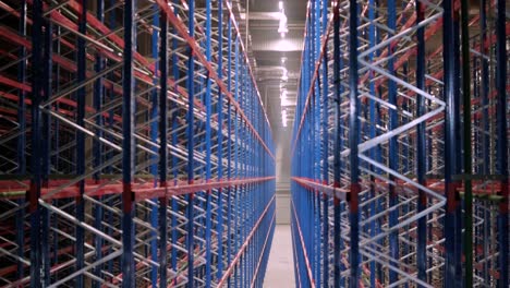 big and modern warehouse under construction, featuring metal shelving and other industrial equipment.