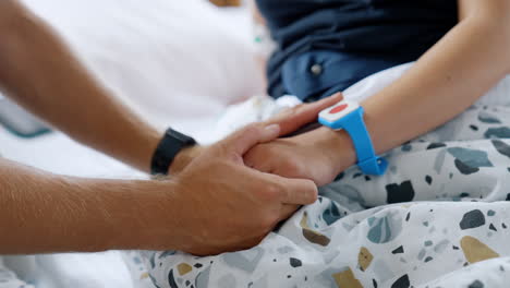 female hand wearing a button to call medical personnel. emergency call device in the maternity hospital. close up.