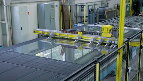 automated glass cutting machine in a factory