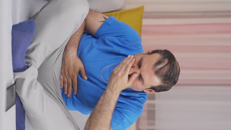 vertical video of man with nausea.