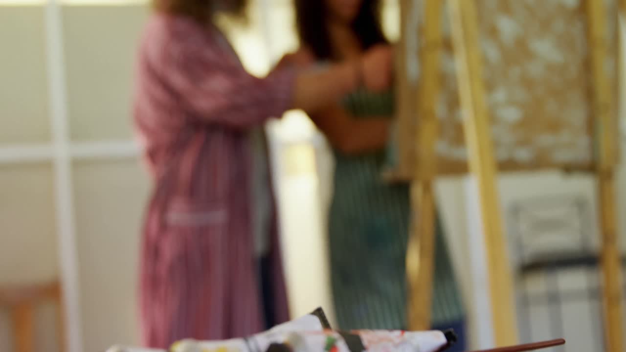 Man assisting woman in drawing 4k