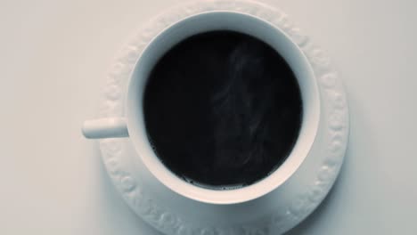 black coffee served with smoke from hot coffee