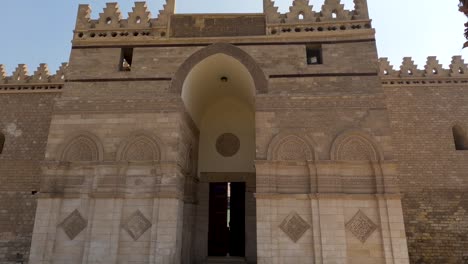 entrance of al-hakim mosque in egypt. tilt down