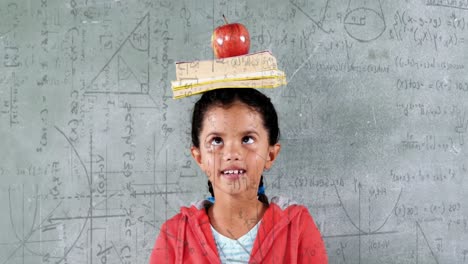 composición digital de ecuaciones matemáticas flotando contra una chica equilibrando un libro y una manzana en ella