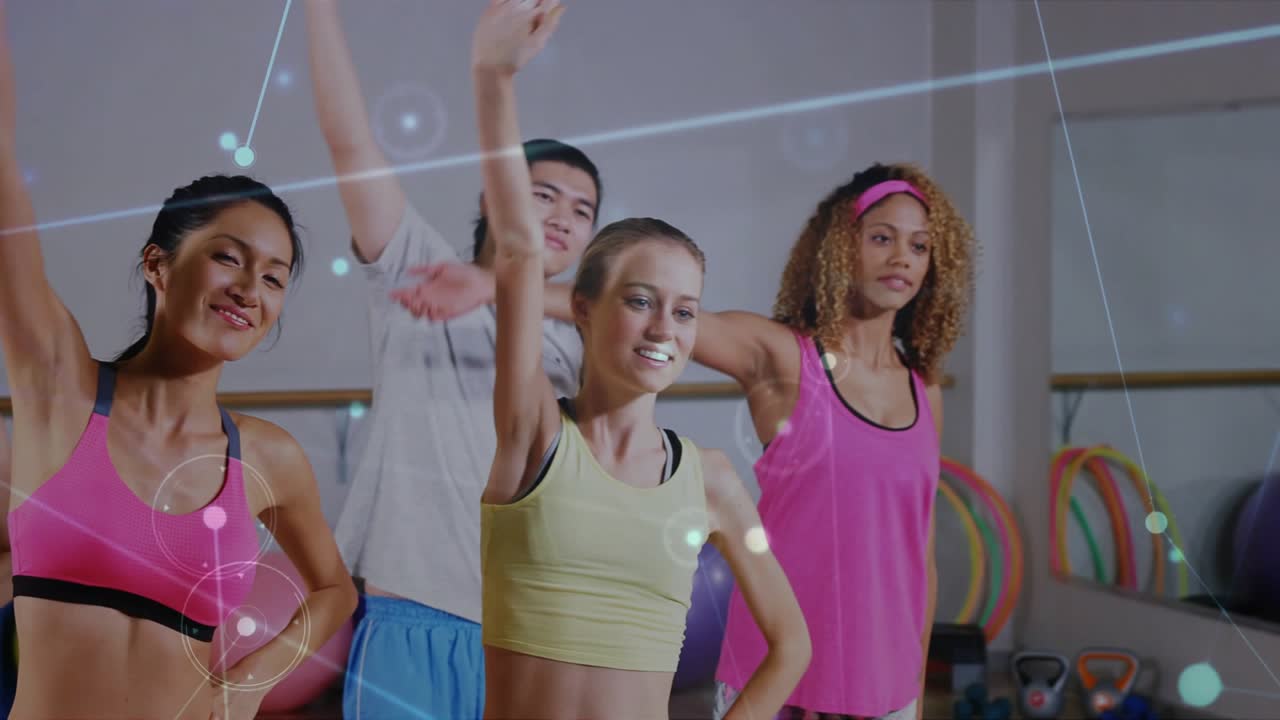 Fitness class doing stretches in sync, camera widening revealing overlay syncing motion for workout