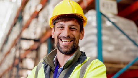 warehouse worker smiling in safety gear