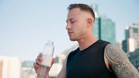 city, fitness and man drinking water