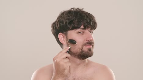 man performing facial massage